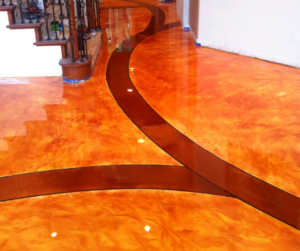 Highly decorative maroon and copper metallic epoxy floor in a residential foyer