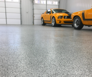 Gray flake flooring in a sports car garage