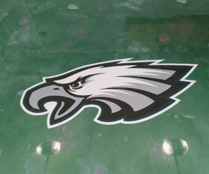 Green metallic floor with a Philadelphia Eagles logo embedded