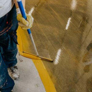 Professional installing an epoxy floor. 