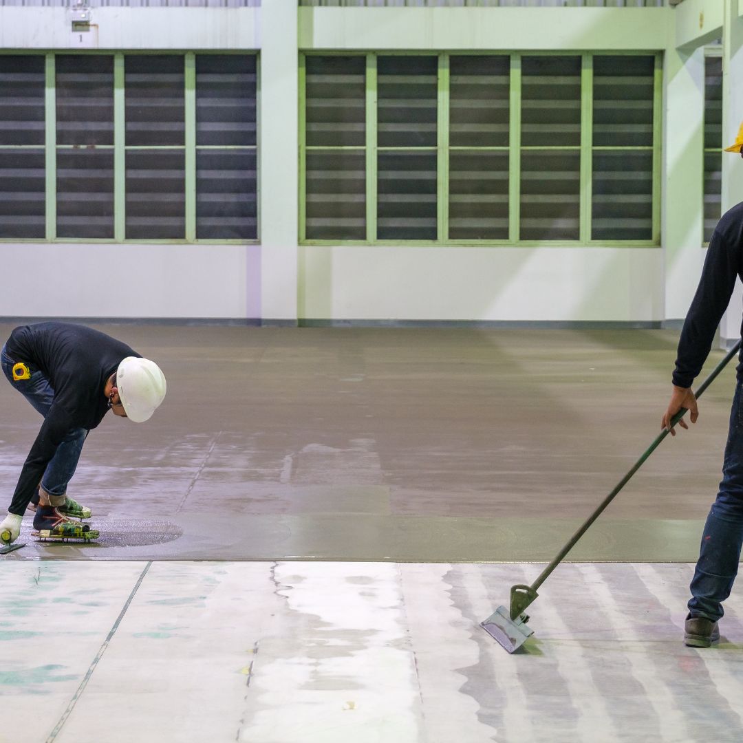 workers applying epoxy flooring
